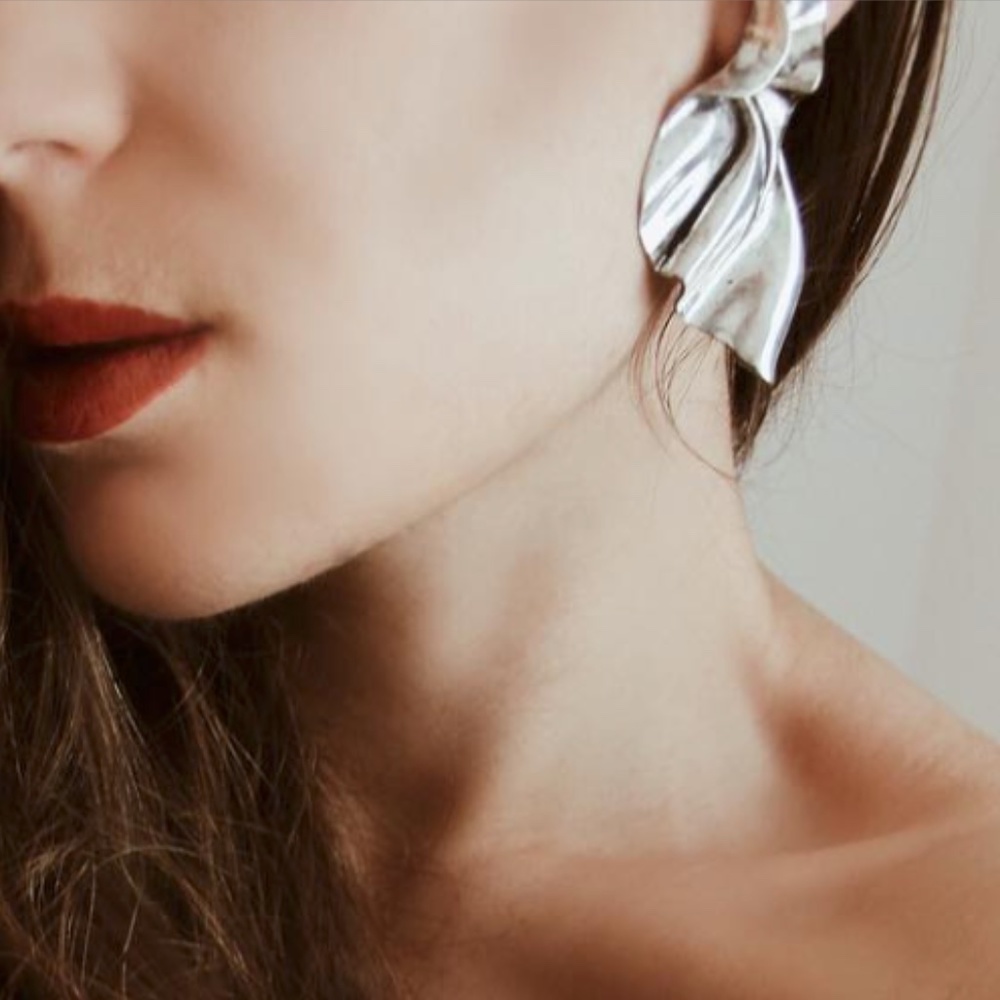 Zara leaves wrinkles big statement earrings